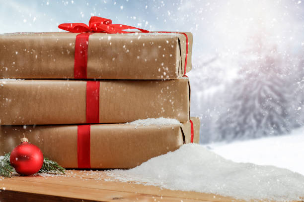 istock Christmas presents with winter background. 1185054587