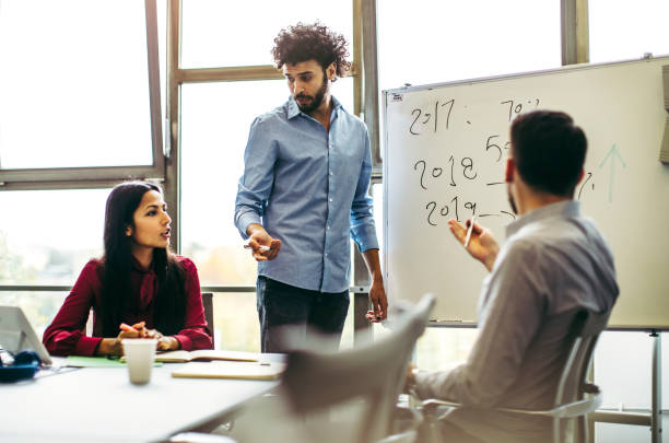 istock Business people discussing in the board room 1185054855