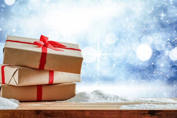 istock Christmas presents with winter background. 1185054881