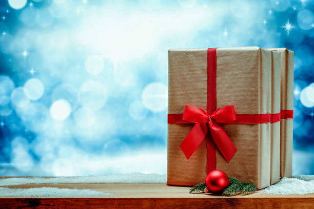 istock Christmas presents with winter background. 1185054884