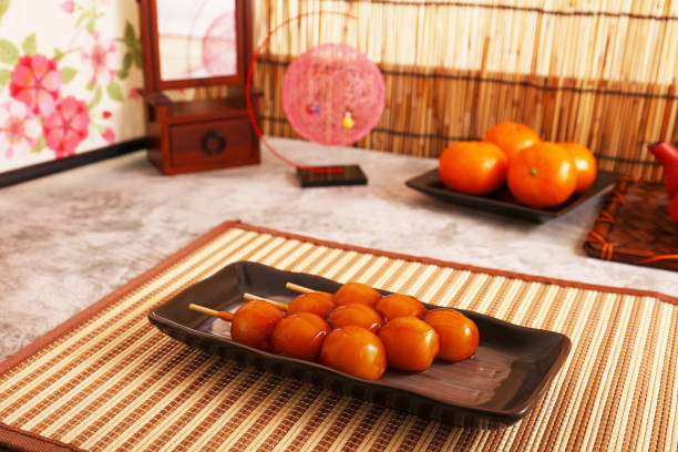 Skewered rice dumplings covered in sweet soy sauce