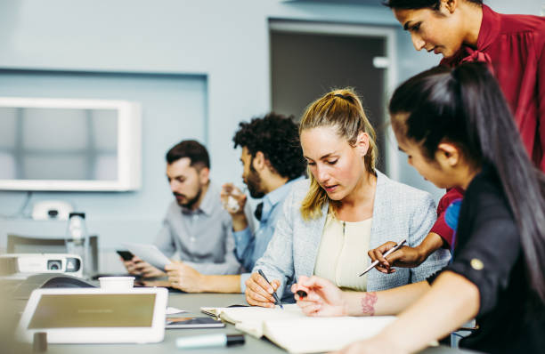 istock Business people discussing in the board room 1185056031
