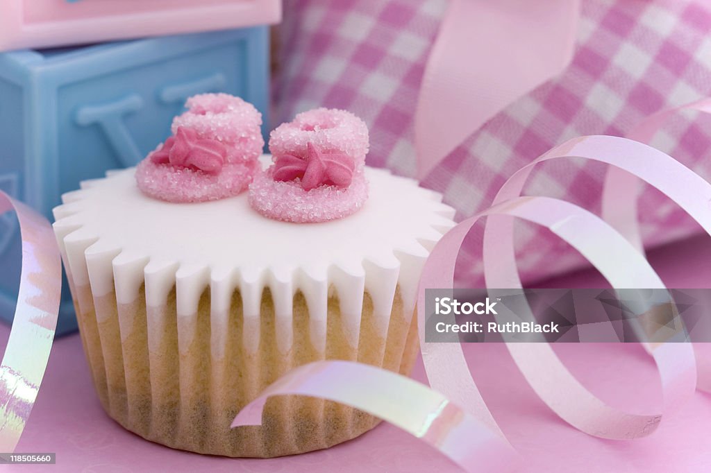 Cupcake for a baby shower  Baby Booties Stock Photo