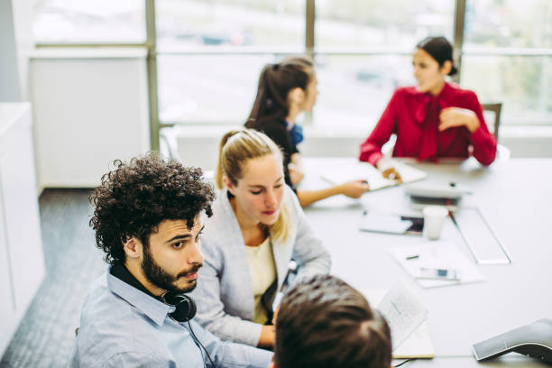 istock Business people discussing in the board room 1185057827