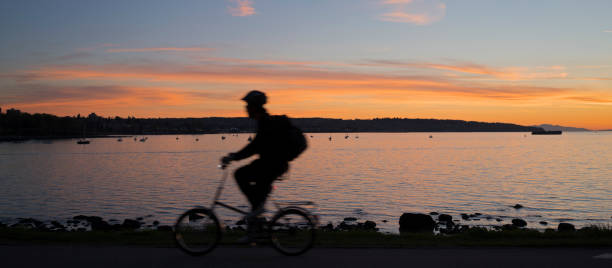 istock Blurred cyclist seaside at sunset 1185060904