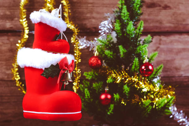 istock Red boot christmas or Santa's shoe on rustic wooden table,Christmas background. 1185062649