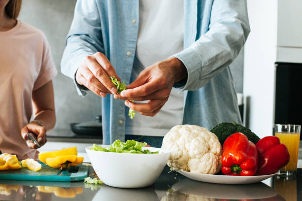 istock young couple cooking a vegetarian breakfast 1185063584