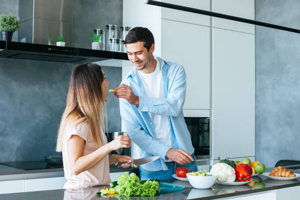 istock young couple cooking a vegetarian breakfast 1185063668