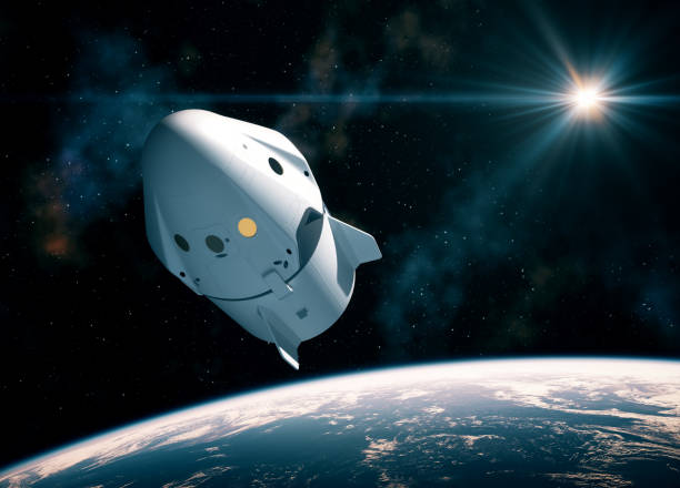 nuova capsula spaziale commerciale in orbita attorno al pianeta terra - veicolo spaziale foto e immagini stock