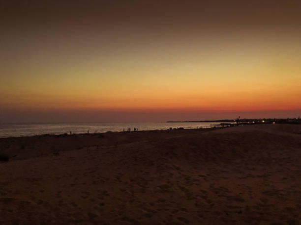 istock The sun sets in the sea in summer 1185066038