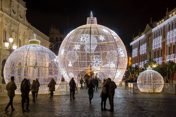 Seville, Spain - December 15, 2017: Illuminated holiday decorations on San Francisco square near city hall in the center of Seville