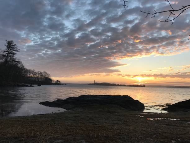 istock Sunrise with Clouds over the bay 1185074738