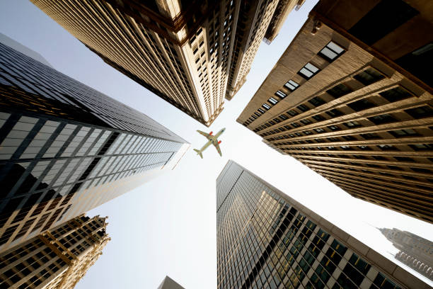 istock Airplane flying over skyscrapers, Lower Manhattan, NYC. 1185074765