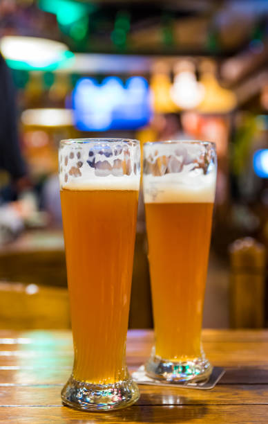 istock two glass of light beer stands on a table in a bar or pub 1185074986