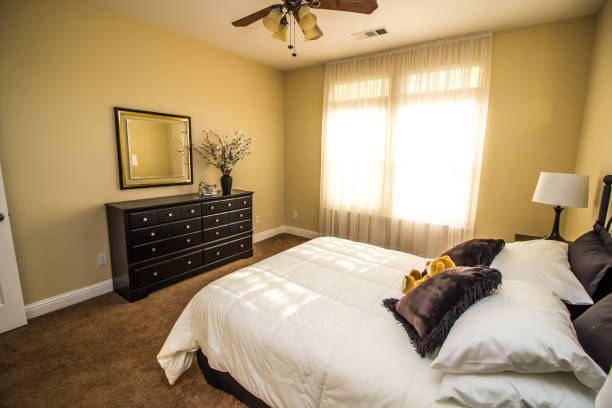 istock Modern Bedroom With Dresser, Mirror And Bed 1185076335