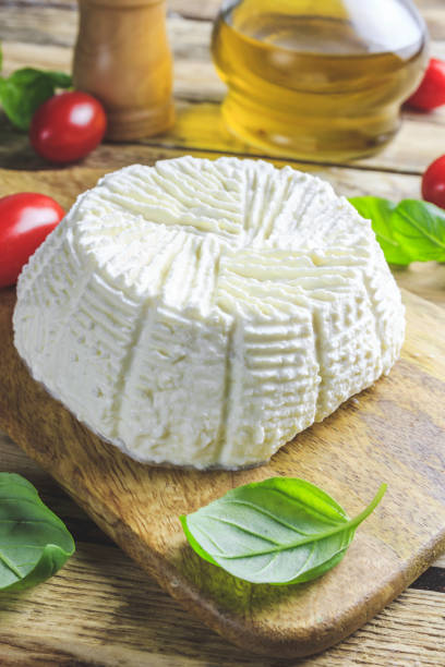 istock Fresh ricotta cheese with basil 1185079874