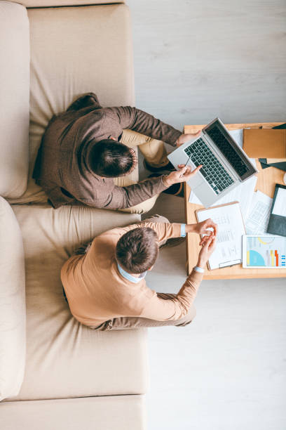 istock Young broker discussing new working ideas, points or strategies with colleague 1185081132