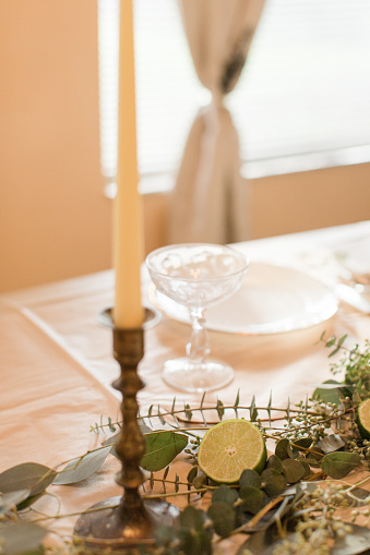 Thanksgiving dinner table decorations. Vintage china, drink ware and silverware.