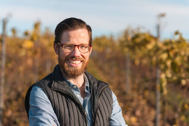 istock Man working on a small vineyard in Sweden 1185082380