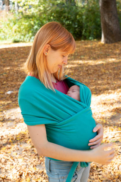 istock Mother carrying a newborn baby 1185083182
