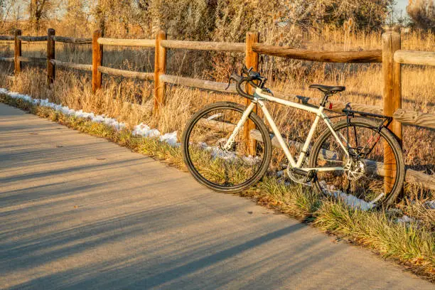 touring bike on a bike trail in late fall scenery - Poudre River Trail in northern Colorado