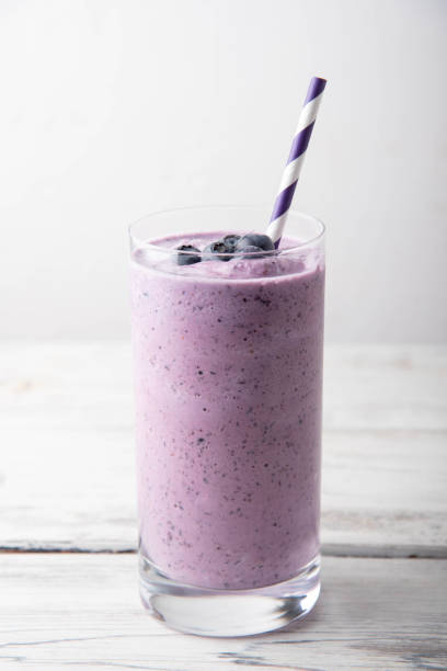 istock blueberry smoothie on white background 1185085753