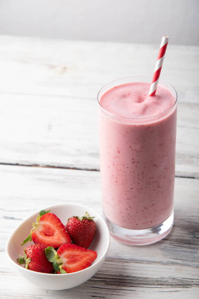 istock strawberry smoothie on white background 1185085996
