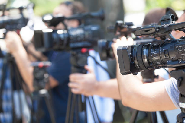 istock Filming media event with a video camera. News conference. 1185087724