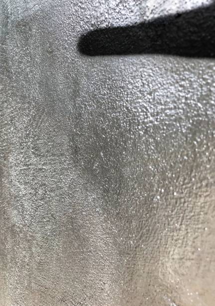 istock Closeup of freshly painted silver metallic wall 1185089846