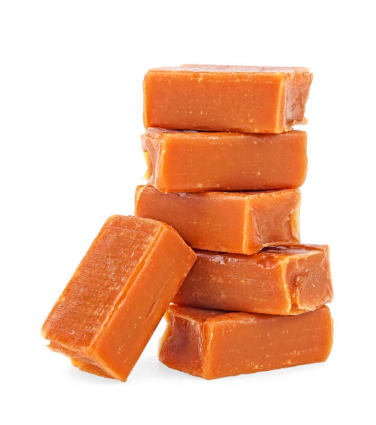 istock Caramel candies isolated on white background 1185093564