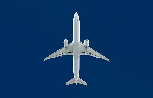 Image of aircraft taken from below, with blue sky in the background.