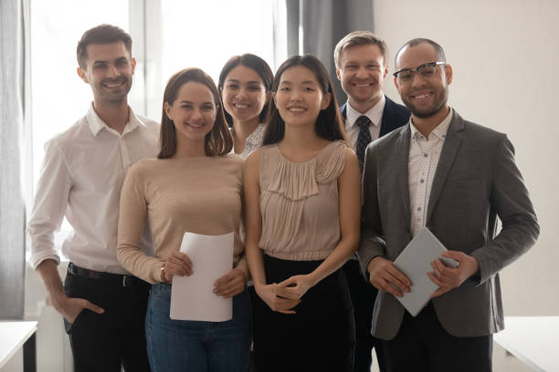 istock Multicultural professional work team happy employees group looking at camera 1185095704