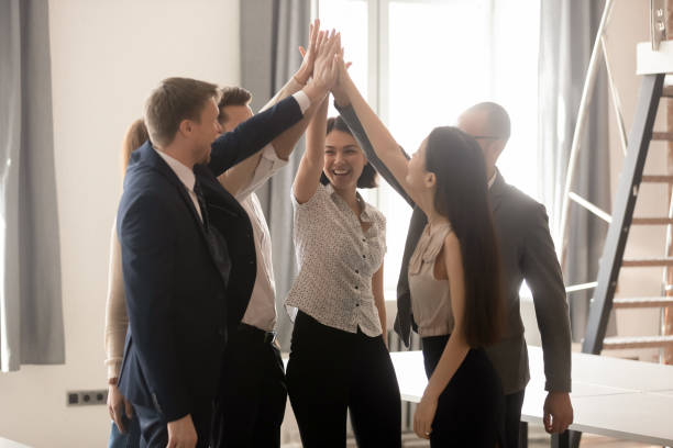 istock Excited multicultural business people give high five engaged in teambuilding 1185095714