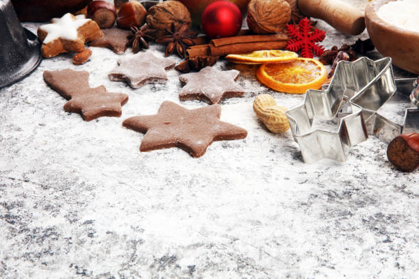 istock Baking christmas cookies. Typical cinnamon stars bakery with spices. xmas decoration on table 1185095910