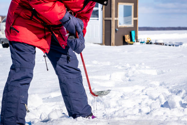 istock Ice fishing in Canada. 1185097276