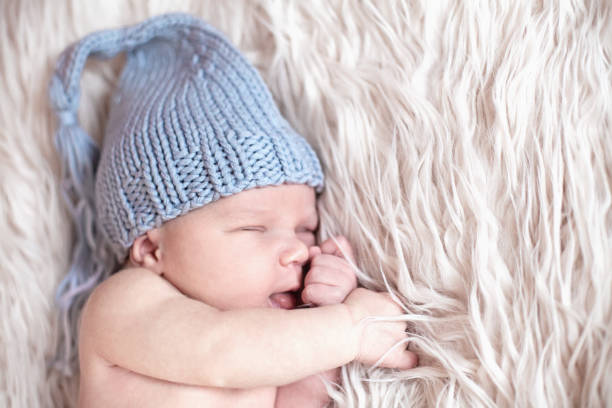istock Newborn baby sleeping on white background 1185099059