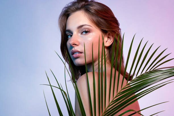 istock Cute lady with fern leaves 1185100761