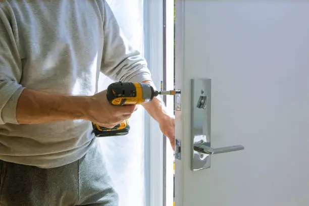 Photo of Installation with a lock in the door leaf using an drill screwdriver