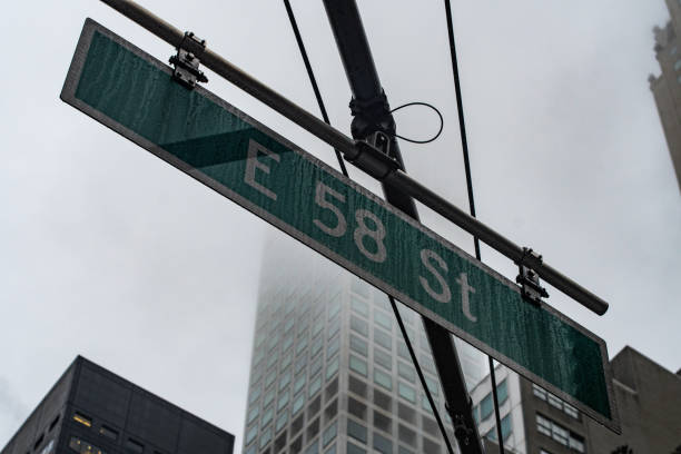 istock 58 st sign NYC manhattan with rain background 1185101990