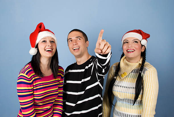 istock Happy Christmas friends looking up 118510779