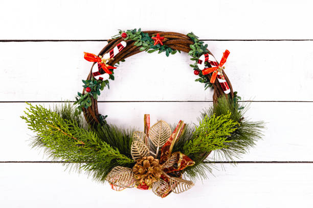 istock Circular garland on white wood background. Background with christmas concept 1185111373