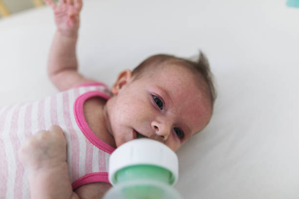istock Little baby drinking milk 1185114330