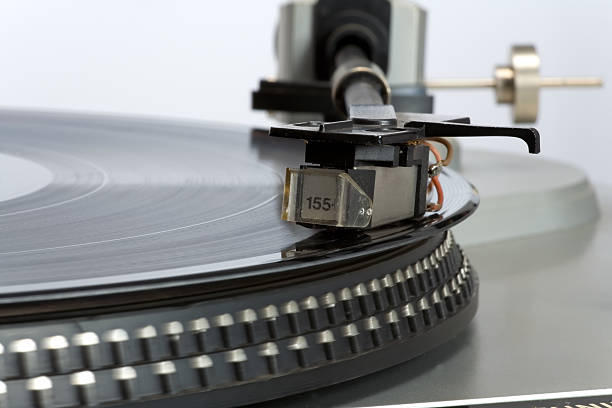 istock Stylish 20-years old turntable with vinyl record having 118511919