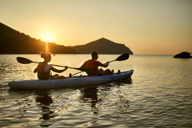 istock Spanish Tandem Kayakers Paddling in Mediterranean at Dawn 1185119965