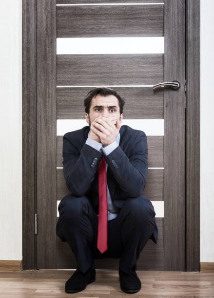 insecure man waiting for a job interview - overstrained imagens e fotografias de stock