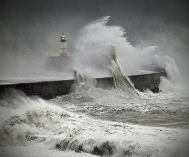 Lighthouse and ocean storm Mighty waves in the English channel overwhelm Newhaven harbour lighthouse, East Sussex. UK
Colour image but looks monochrome high tide stock pictures, royalty-free photos & images