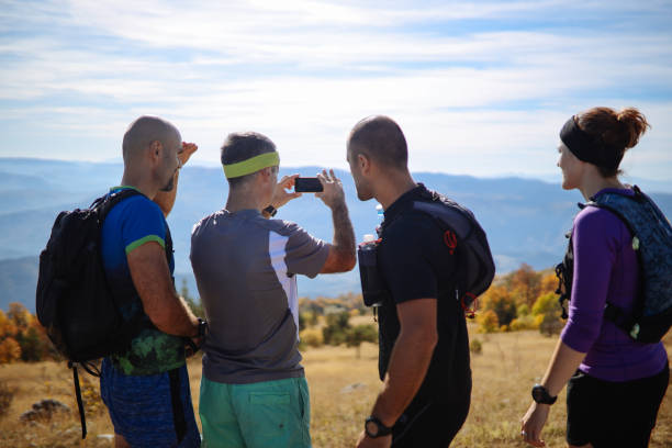 istock Group of people exercising in the nature 1185126928