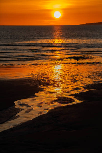 Beach and tidal stream at sunrise, Plum Island, Parker River National Wildlife Sanctuary, Massachsetts