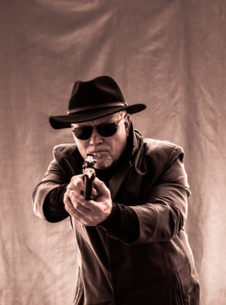 istock Ganster with a cigar and weapons, a Mauser system pisto 1185128827