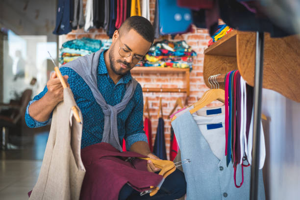 istock Clothing store owner arranging the workplace 1185128924